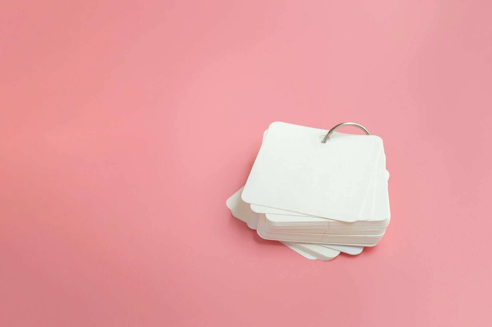 Flashcards on a pink background