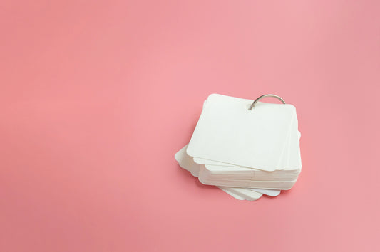 Flashcards on a pink background
