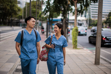LPN and RN walking on the sidewalk talking