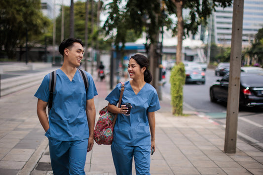 LPN and RN walking on the sidewalk talking