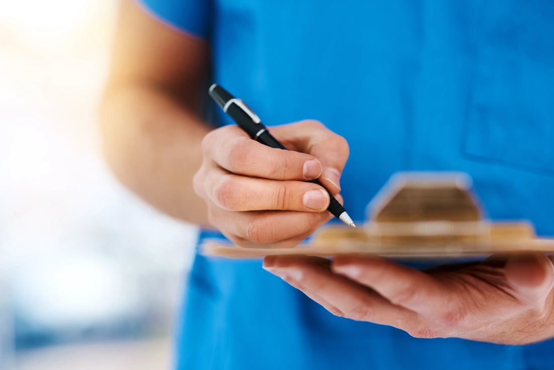 Male Nurse Writing Nursing Notes