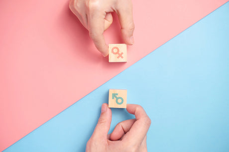 Male vs Female on a blue & pink background
