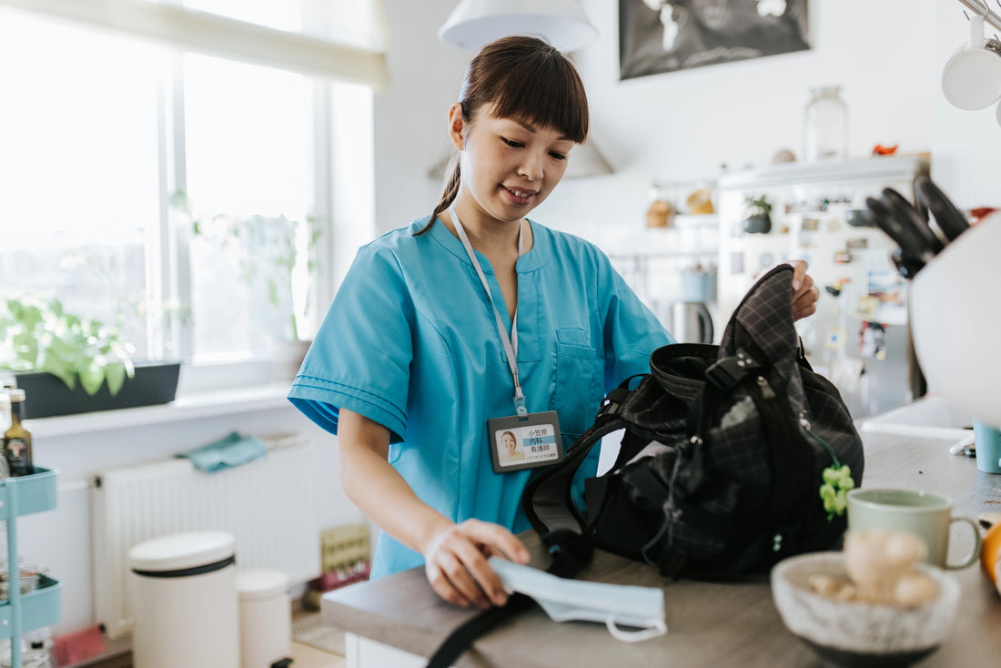 Nurse packing bag in kitchen