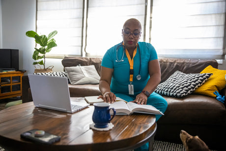 Nurse studying on Couch