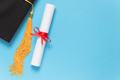 Nursing Diploma with Graduation cap on light blue background