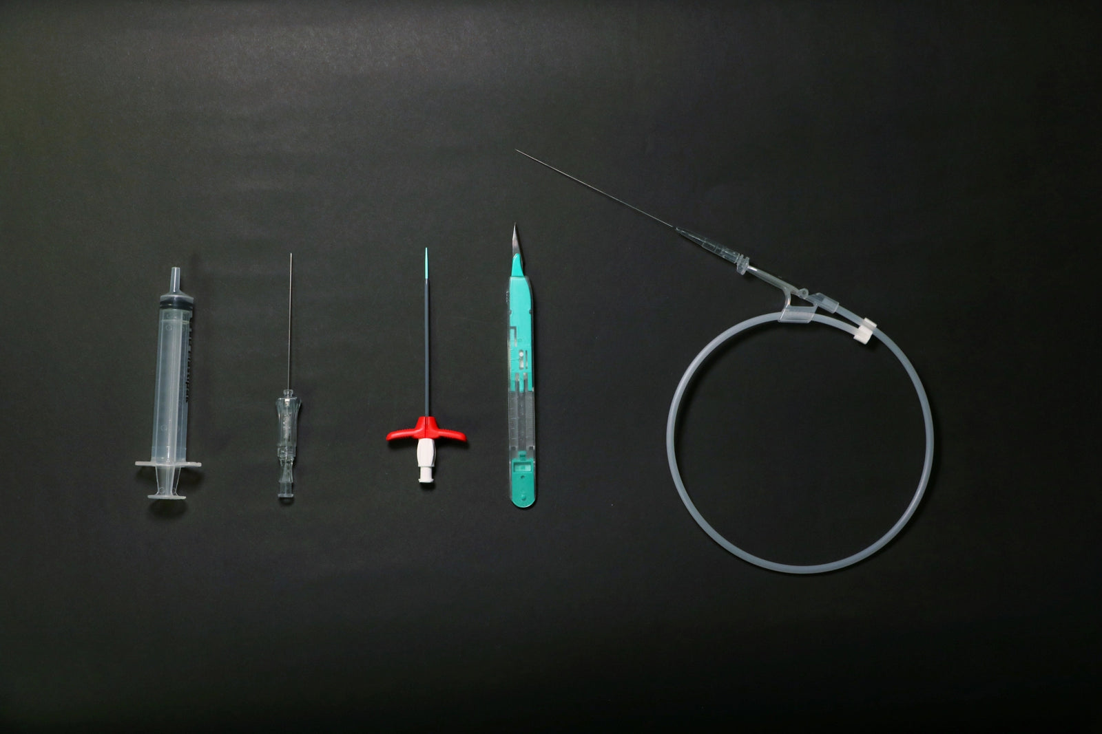 Picc Line Materials Laid On Black Background