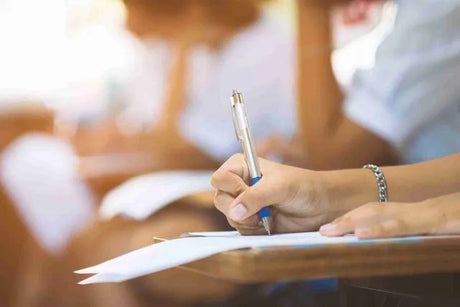 how many times you can take NCLEX title card with nursing student taking notes