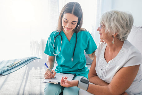 nursing diagnosis guide Nurse Measuring Blood Pressure Of Senior Woman At Home Smiling
