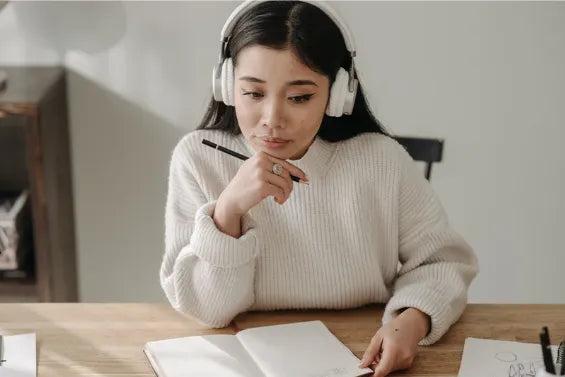 Young Asian woman studying for National Council Licensure Examination (nclex) National Council of State Boards of Nursing (NCSBN)