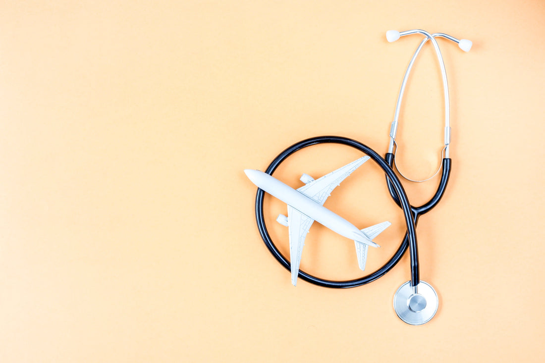Stethoscope and airplane on an orange background