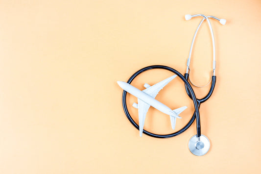 Stethoscope and airplane on an orange background