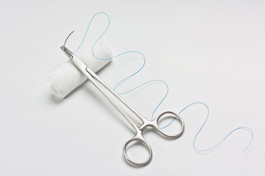 Suture Materials on a White Background