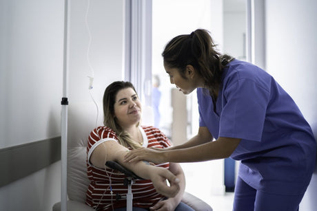 Women receives IV drip treatment