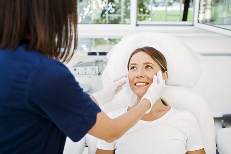 Nurse assessing for Chvostek’s sign in a young woman patient.