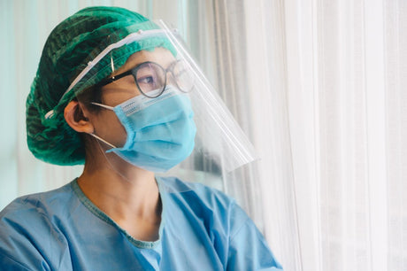 PPE while protecting nurse healthcare workers from exposure to the COVID-19 virus in healthcare settings. Nurse/Doctor wearing PPE suit for working in hospital for protect coronavirus disease.
