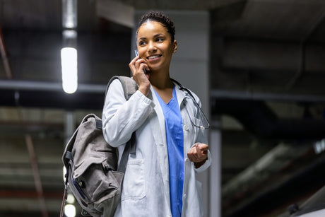 Young Black African American female woman travel nurse talking on phone