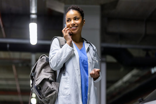 Young Black African American female woman travel nurse talking on phone