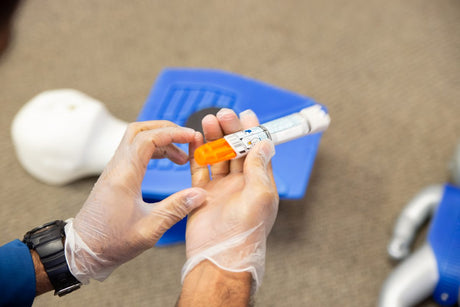 Nurse holding epinephrine - anaphylactic shock pathophysiology title card