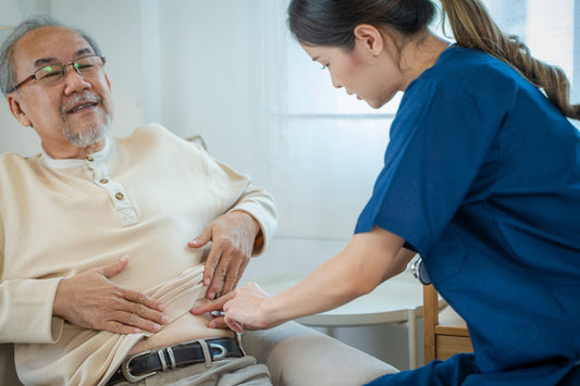 Asian nurse injects a diabetic injection on a patient's stomach,Medical treatment.