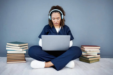 Nursing student, laptop and headphones of hospital music, podcast or radio in woman study research or mock up learning. Thinking, technology and medical student listening to healthcare audio for books success