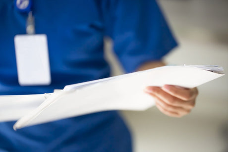 Nurse with medical report at the clinic