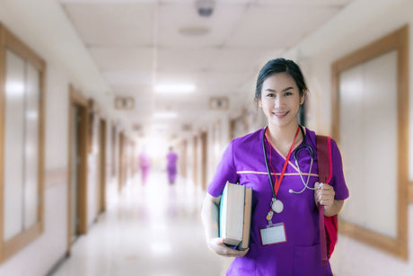 Pretty young Asian nurse in hallway with study materials - nursing compact states title card
