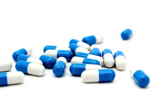 Blue and white capsule pills