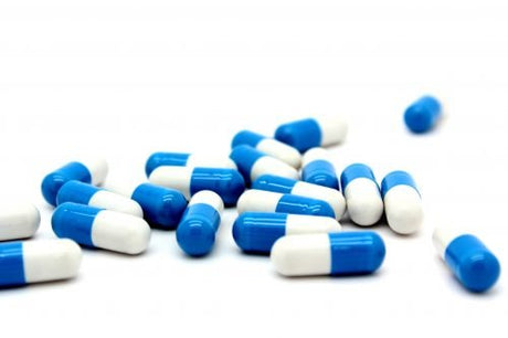 Blue and white capsule pills
