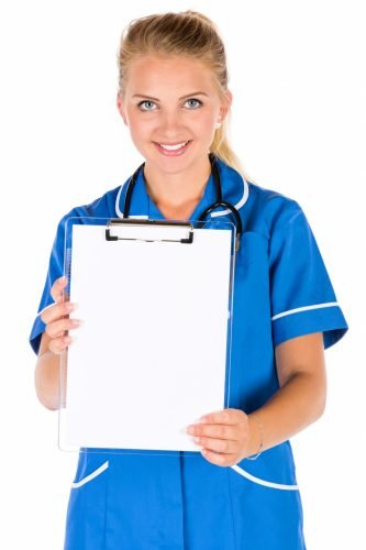 pretty young nurse holding clipboard